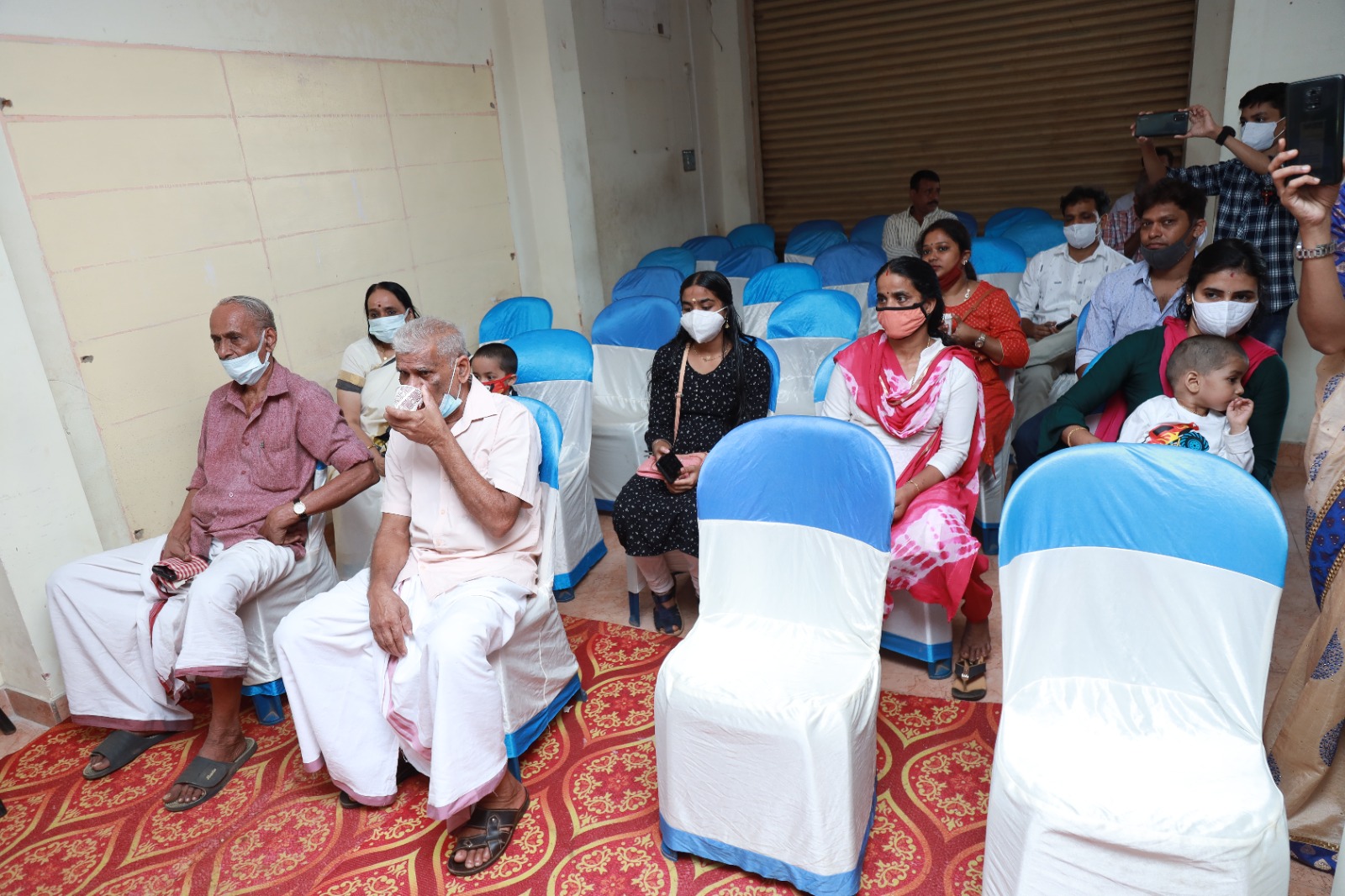 Families seated at the opening ceremony of the Janamitra Ayurveda Centre