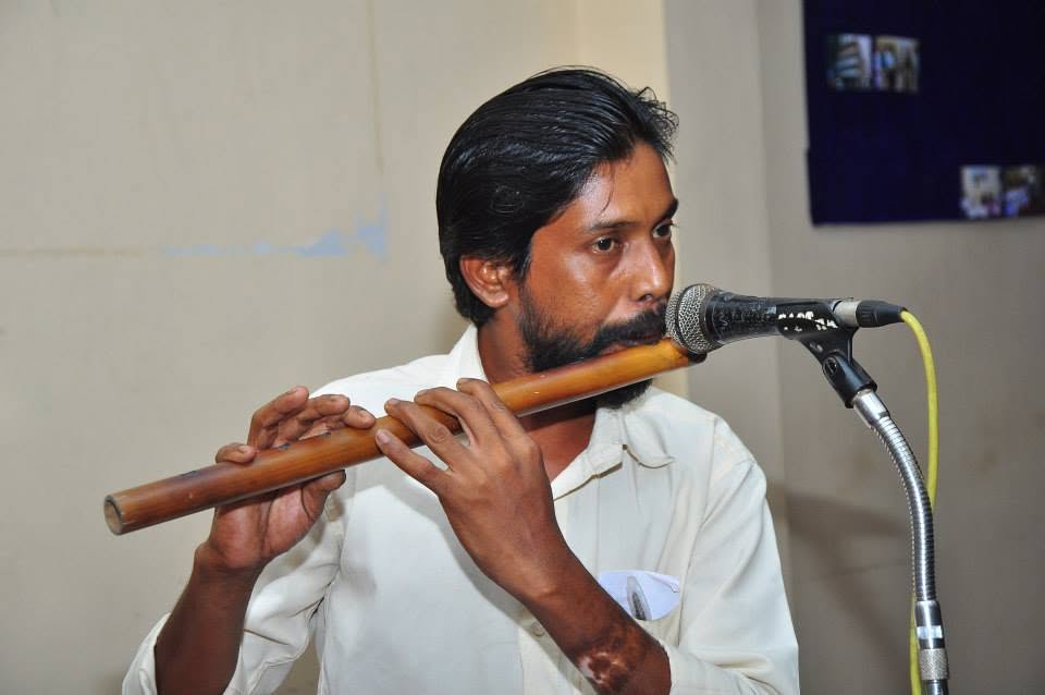 A flute performance at a Janamitra community programme