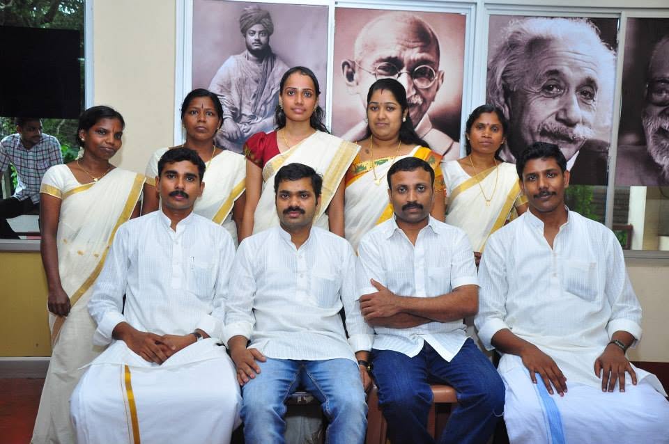 A group photograph in traditional dress at a Janamitra community programme